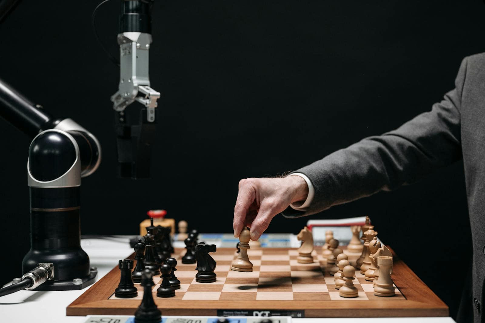 A collaborative robotic arm and human working together on marketing strategy diagrams and analytics dashboards