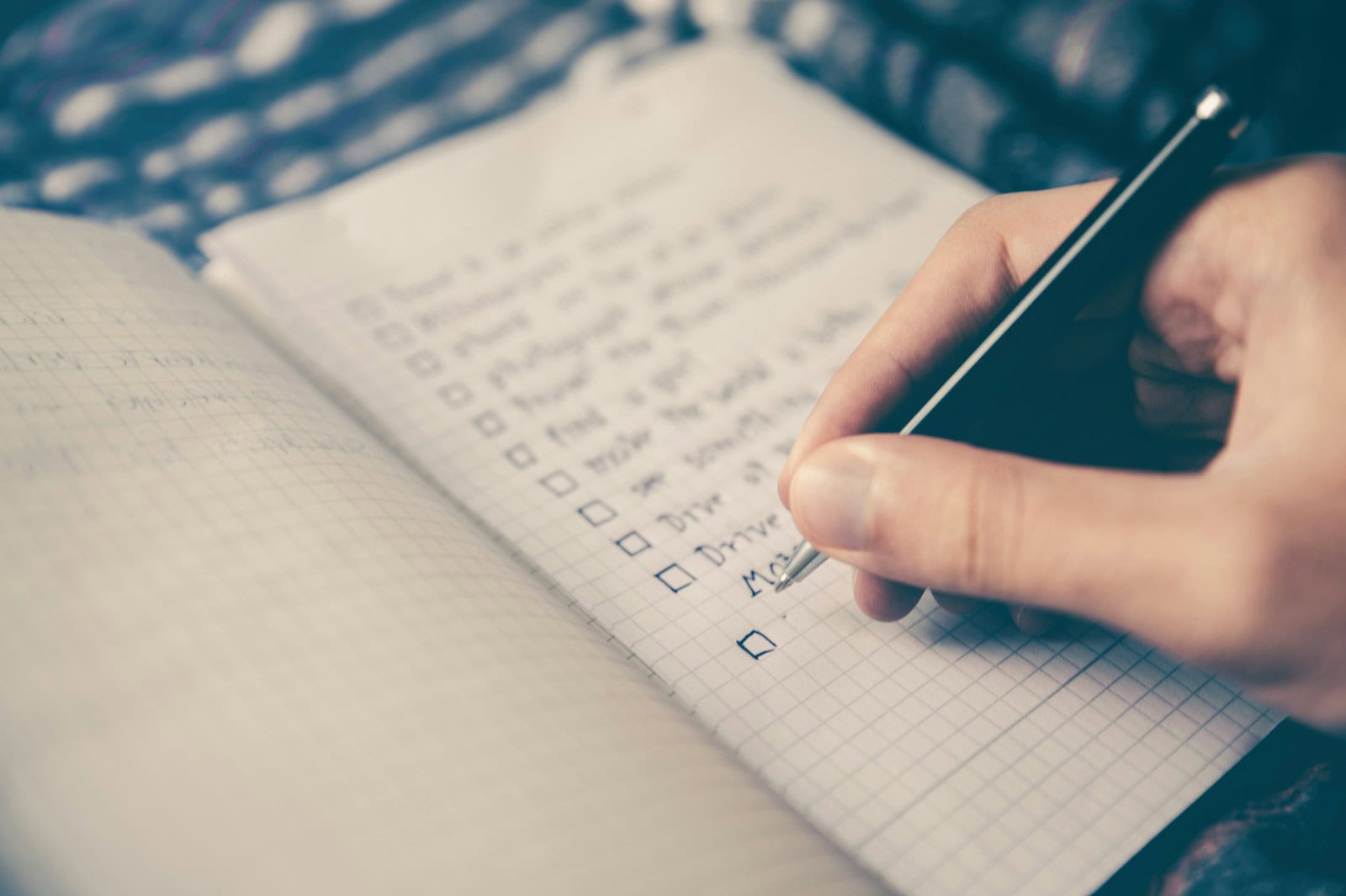 Australian business owner planning a strategic 30-day local SEO action plan with checklist notes and a digital device