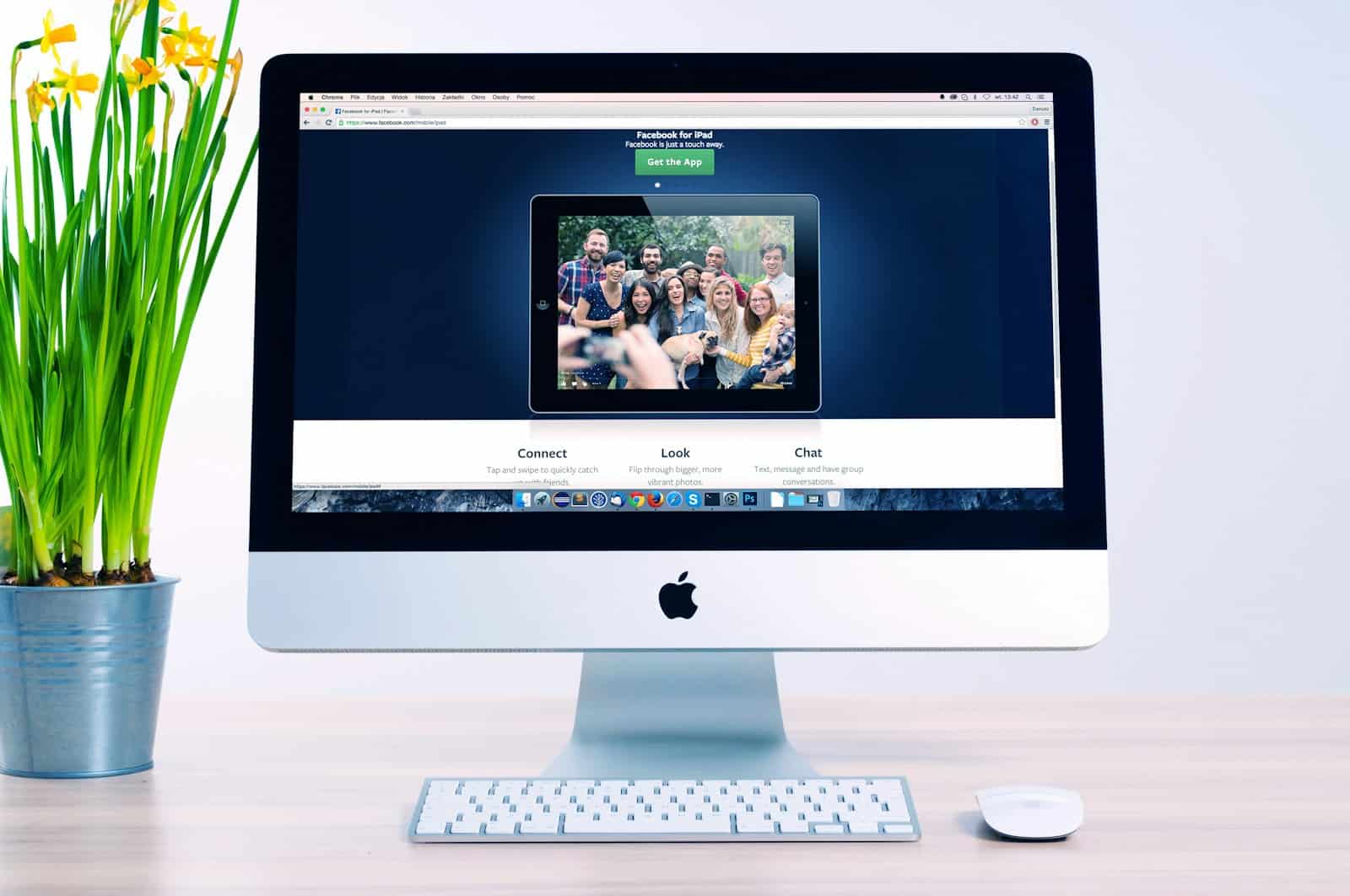 A sleek silver iMac displaying a responsive, modern small business website with mobile-friendly design and local SEO elements.